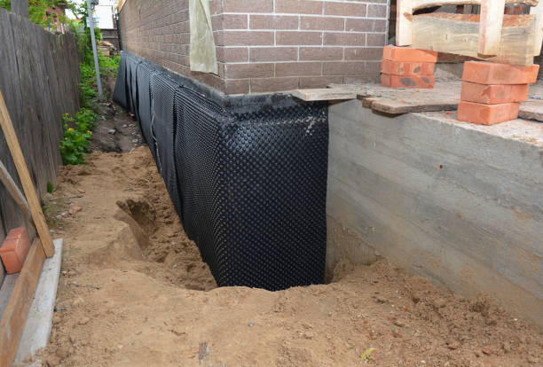 SJ Waterproofing Pros technician performing targeted Exterior Waterproofing assessment in Rising Sun, MD